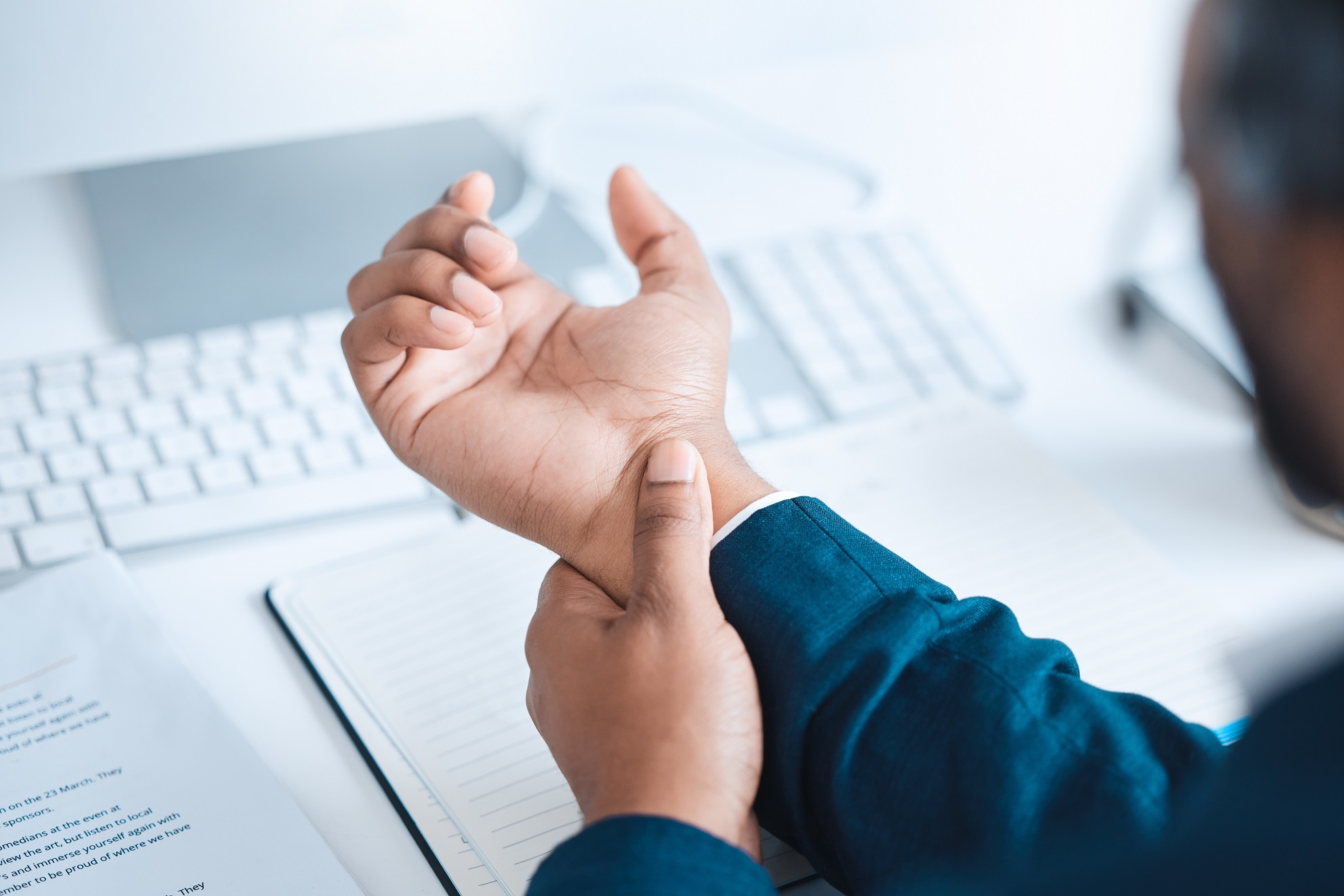 hands of business man with pain carpal tunnel