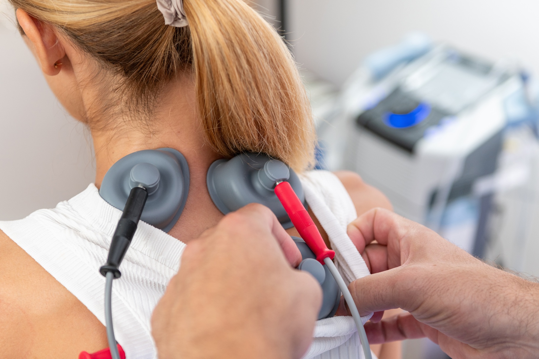 physical therapist using vacuum therapy on the low
