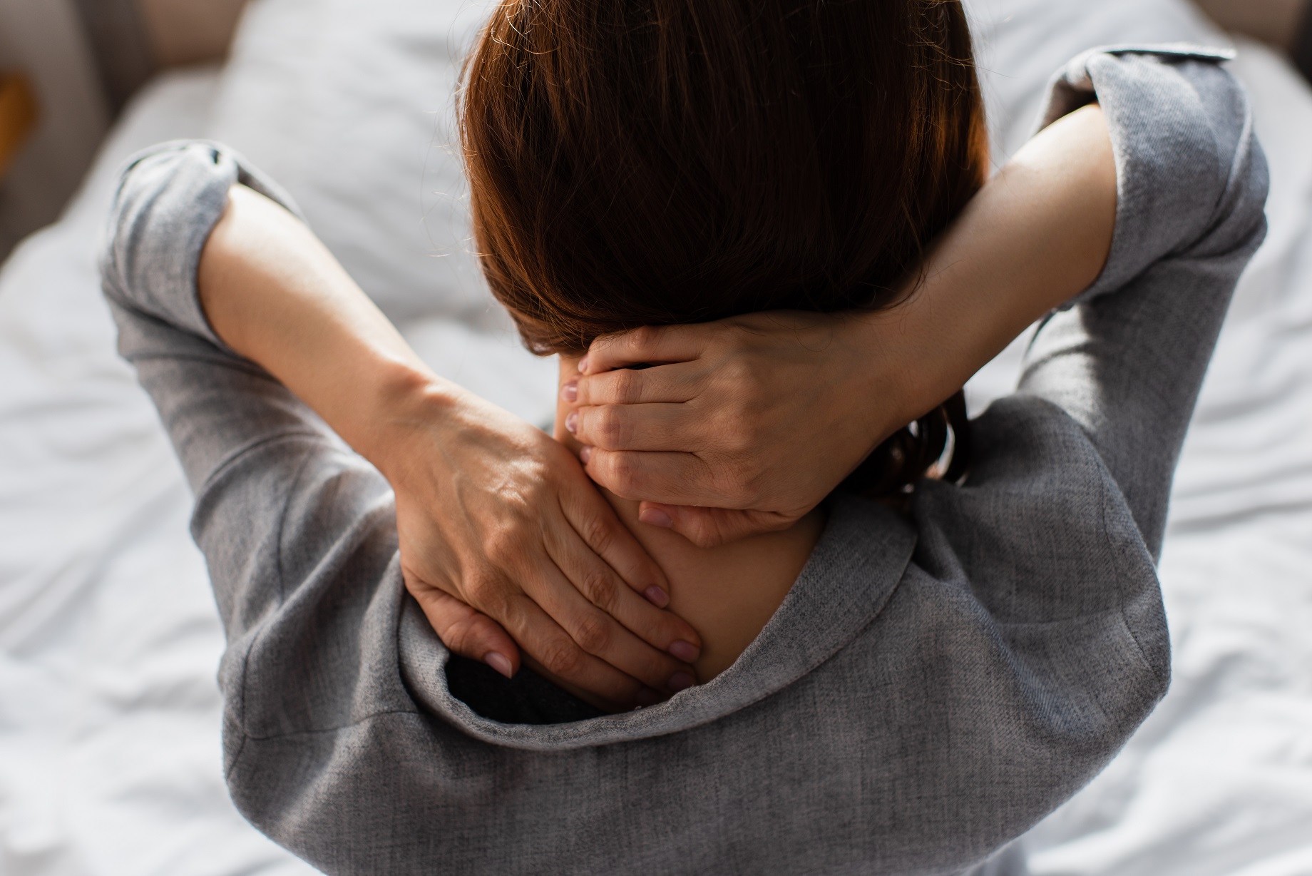 woman having neck pain