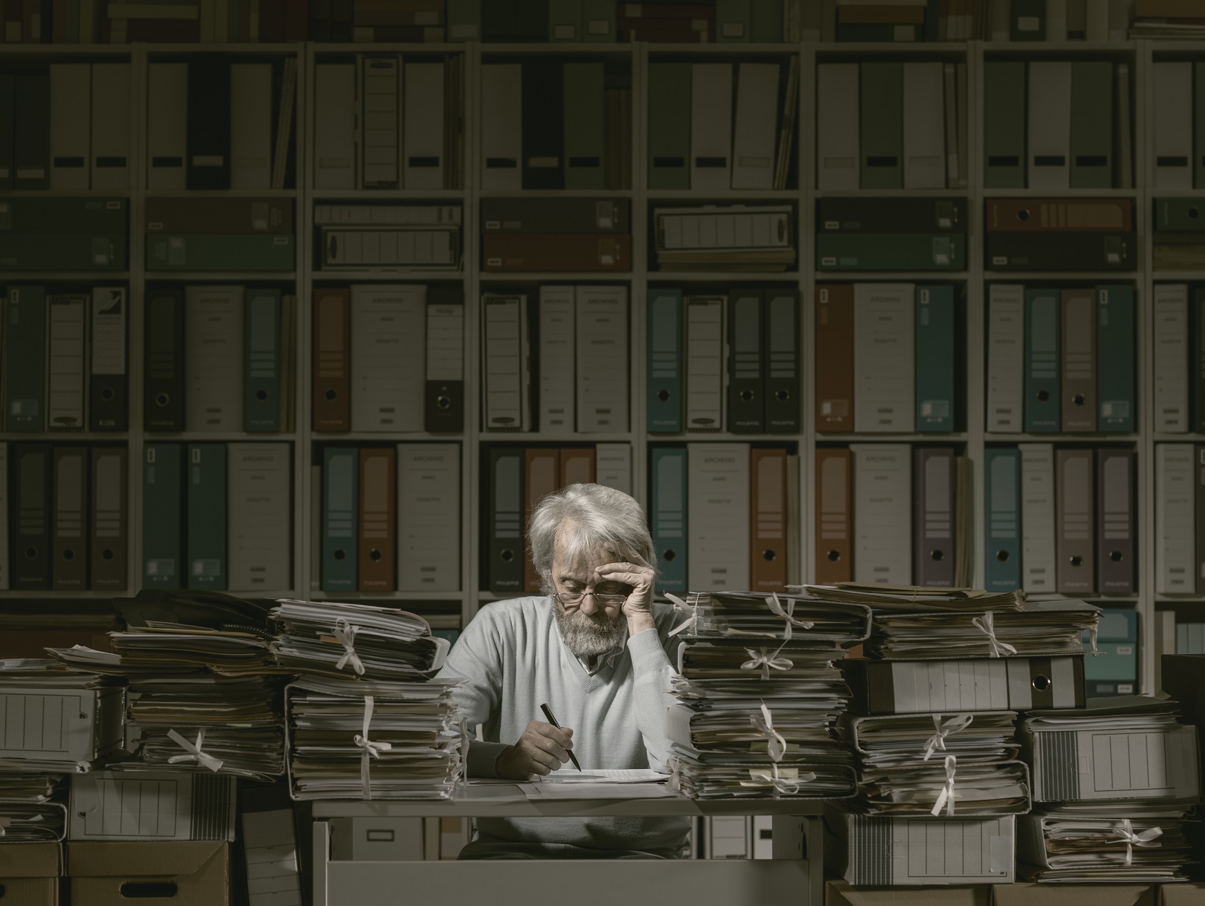overloaded senior office worker