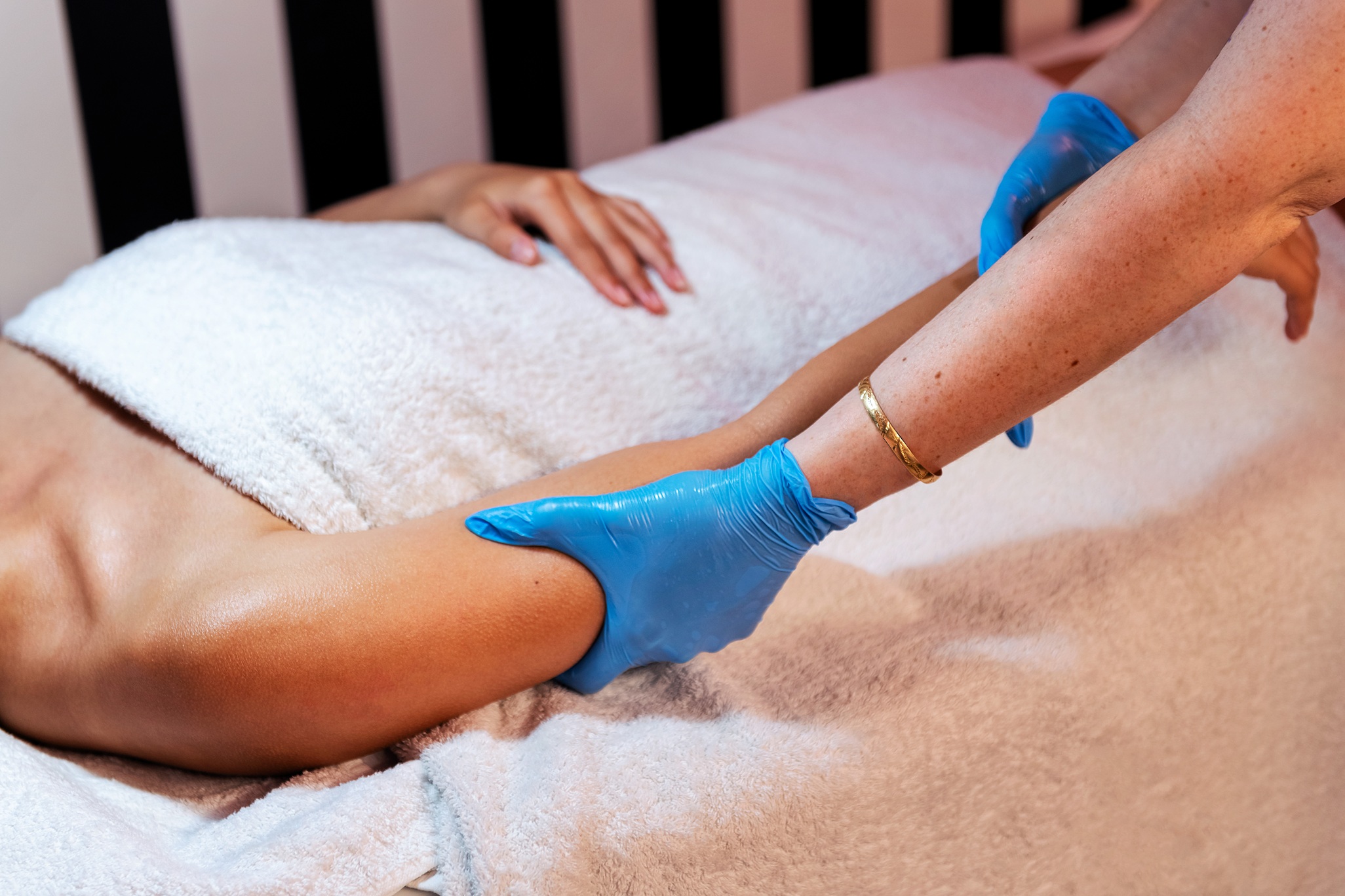 young woman receiving a relaxing arm massage