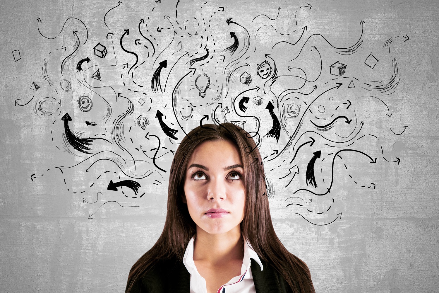 woman looking up at arrows and sketches 2026
