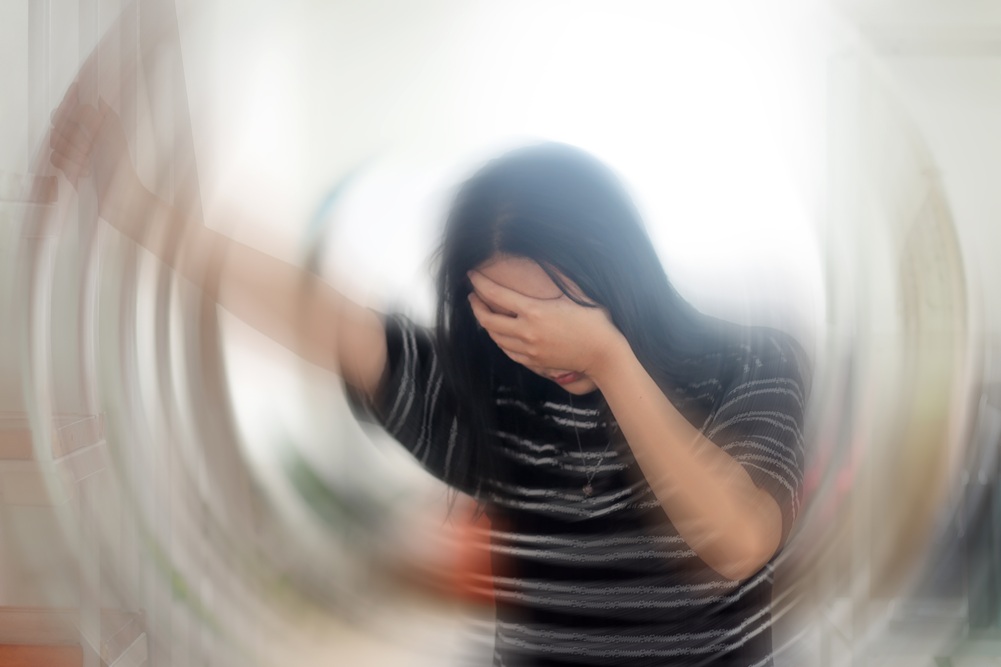 portrait of young woman suffering from vertigo or 2026
