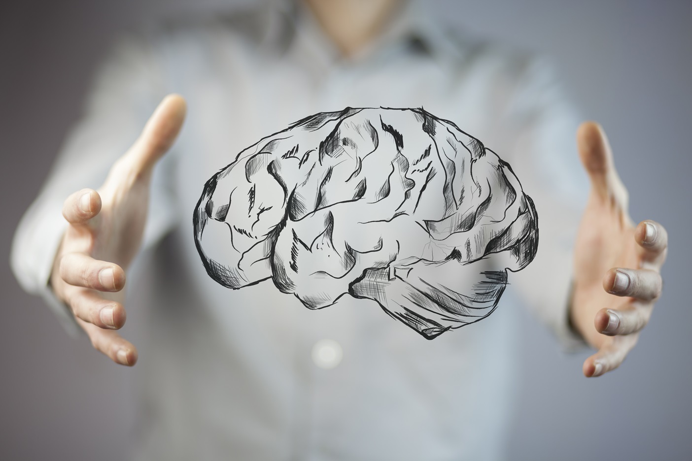 businessman hand holding brain